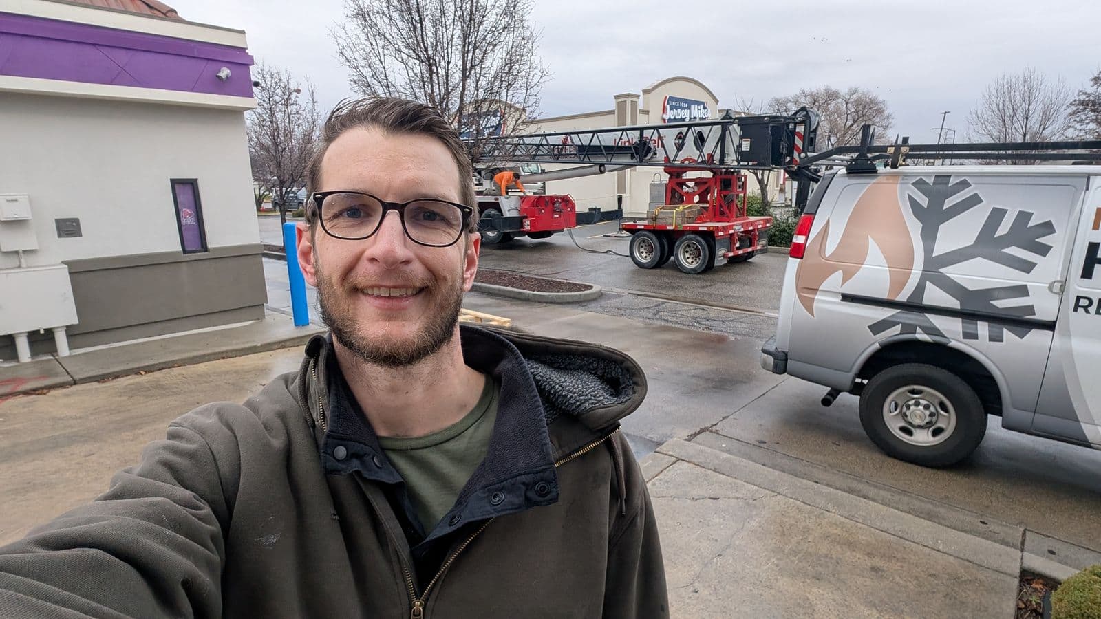Jason with Meridian HVAC service van and crane