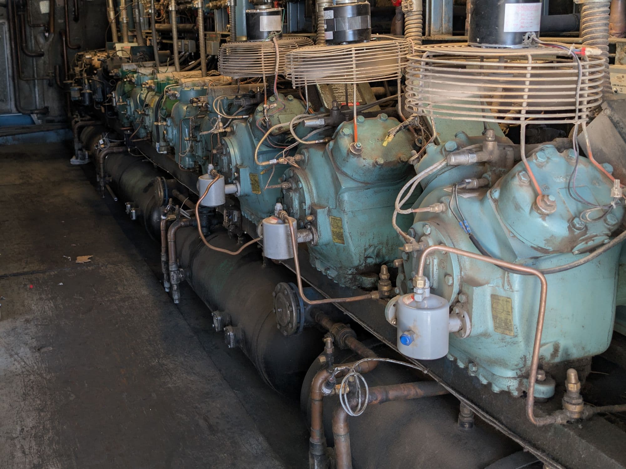 Row of semi-hermetic compressors on a refrigeration rack